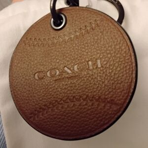 Coach Unique Baseball Hangtag Crafted With Brown Leather.